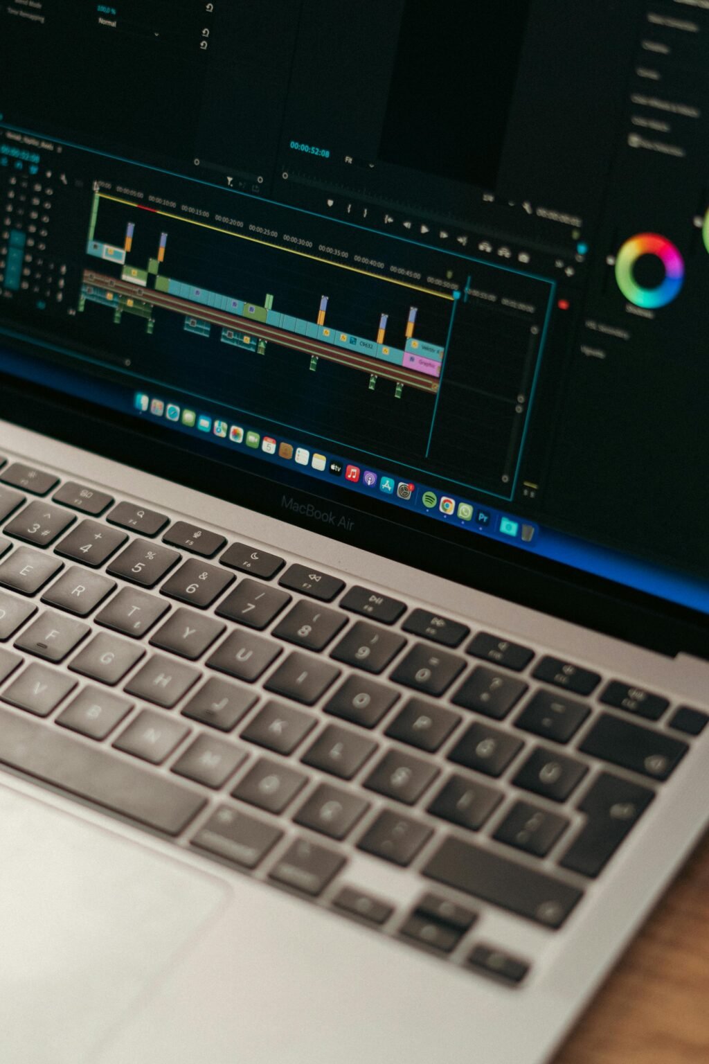Detailed view of video editing software interface on a MacBook Air.